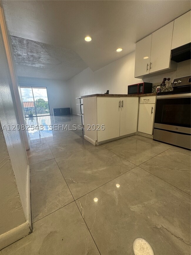 Building Photo - 5530 W 26th Ct Unit 210