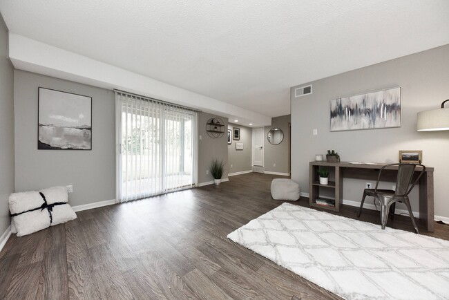Living Room with Hardwood Style Flooring - The Canopy 2200