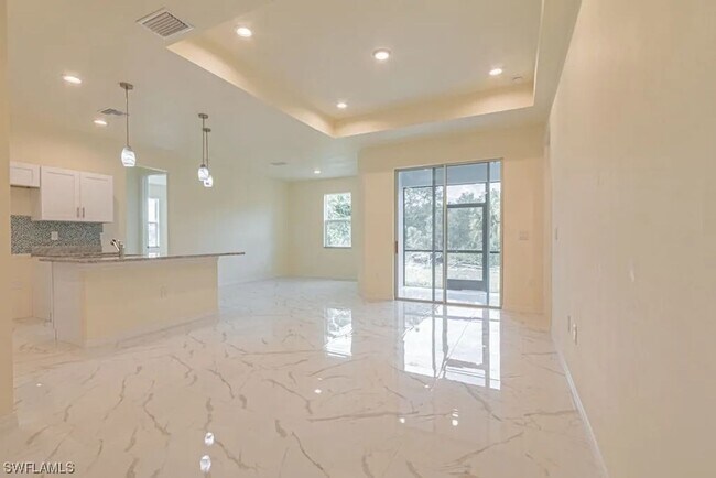 Photo - Stunning 3BR/2BA Home with 2-Car Garage & Screened Lanai in Lehigh Acres