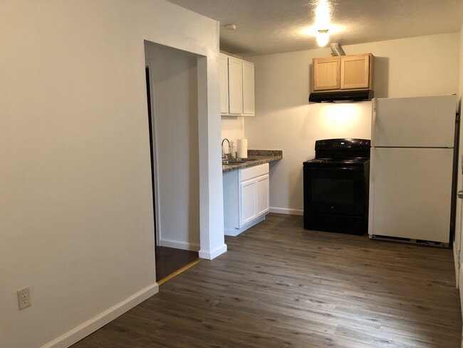 Kitchen with full size refrigerator - 116 Frawley St Apartments Unit 2