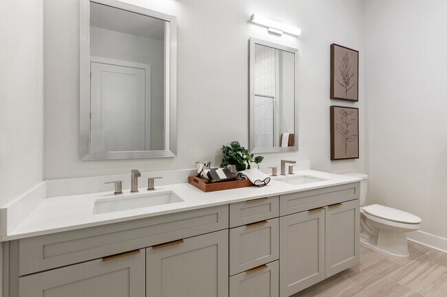 Stylish, spa-inspired bathrooms with framed mirrors and dual vanities available - The Residence Peninsula Apartments
