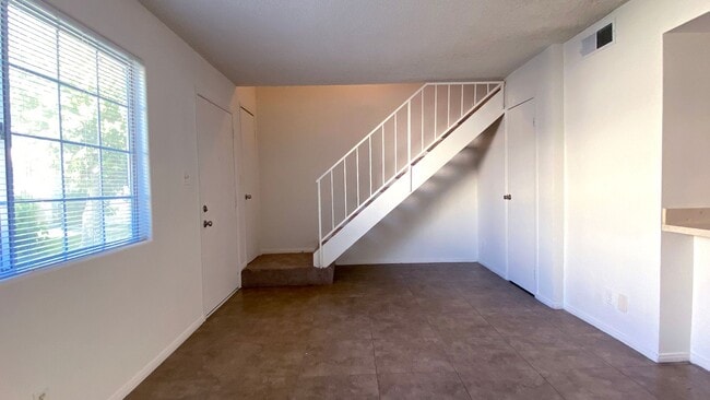 Photo - Great 3 bedroom and 1.5 bath townhouse with a small yard and 2 car garage.