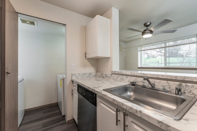 Convenient kitchen design with nearby laundry access.