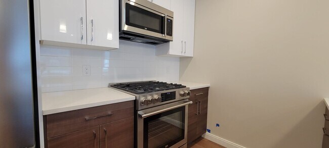 Photo - Large 2bd/2bath with Garage parking! Steps to Commuter Rail!
