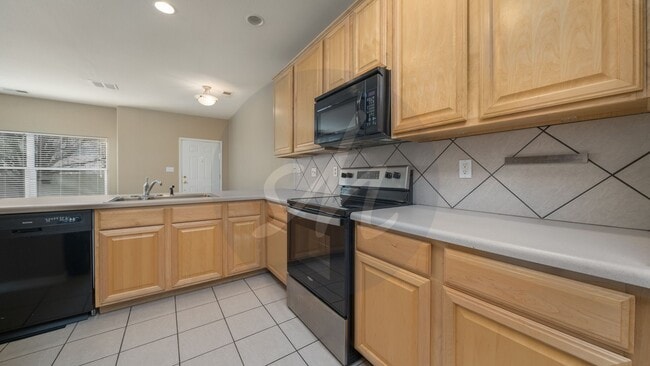 Photo - Spacious 3BR Townhome with 2-Car Garage & Private Covered Balcony