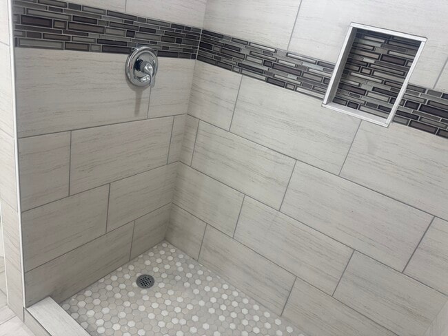 Walk in recently remodeled tiled shower