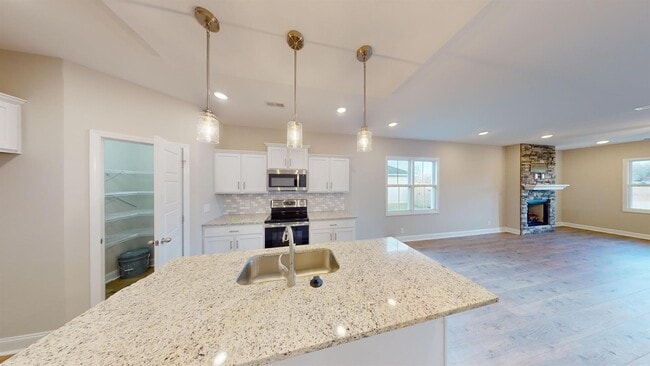 Photo - Stylish Home with Feature Stone Front Fireplace, Open Layout and Premium Upgrades