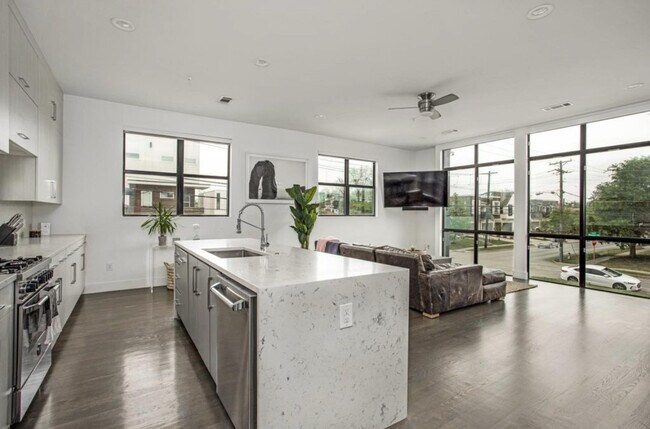 Open kitchen with massive floor to ceiling windows - 2307 N Carroll Ave