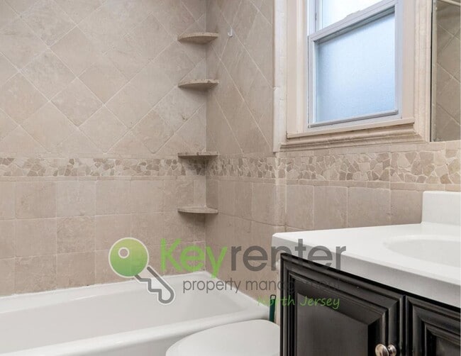 Photo - No Broker Fee | Spacious 3-Bed, 2-Bath Nutley Home with Bonus Office & Gourmet Kitchen