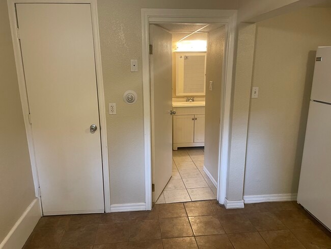 Kitchen to full bathroom - 824 Mathews St