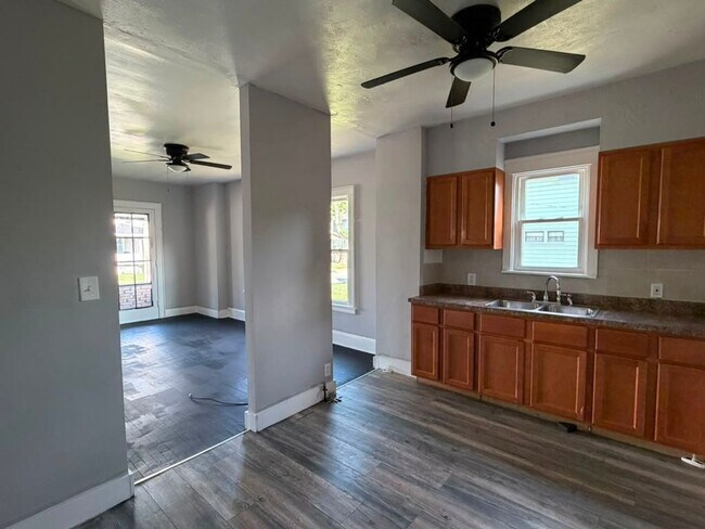 Photo - Four bedrooms. A sunroom. A fenced yard. A garage. Your next home is ready to be discovered!