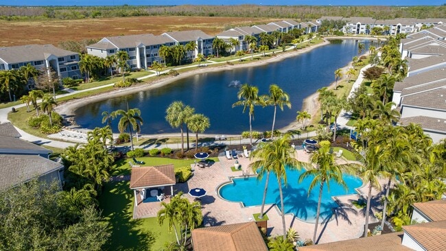 Enjoy a stunning aerial view of our community, offering resort-style amenities, picturesque waterfront views, and a tranquil atmosphere. - Lexington Palms at the Forum Apartments