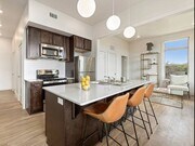 High ceilings, modern lighting, ample kitchen storage