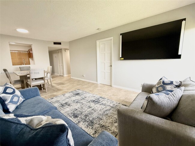 Building Photo - 8550 N Sherman Cir Unit 507 Rental