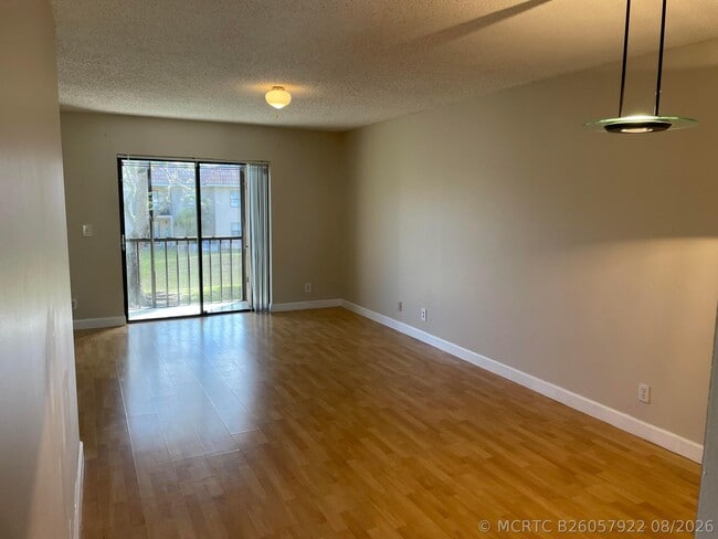Building Photo - 6832 Palmetto Cir S Unit 203