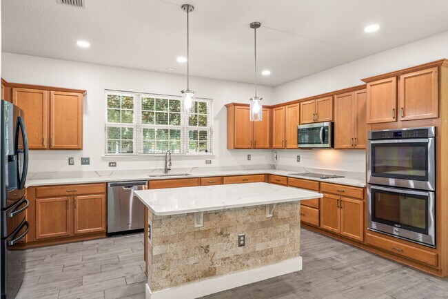 Spacious 3-Bed, 2.5 Bath End Unit Townhome in Windermere with 2 Car Garage!