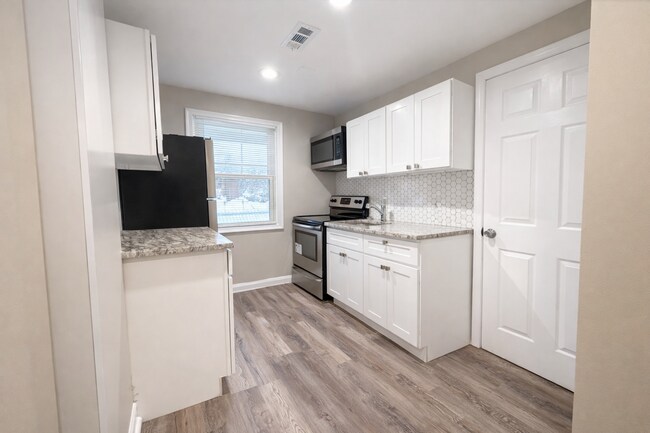 Photo - Charming Updated 2BR Rowhome with Modern Kitchen & Washer/Dryer