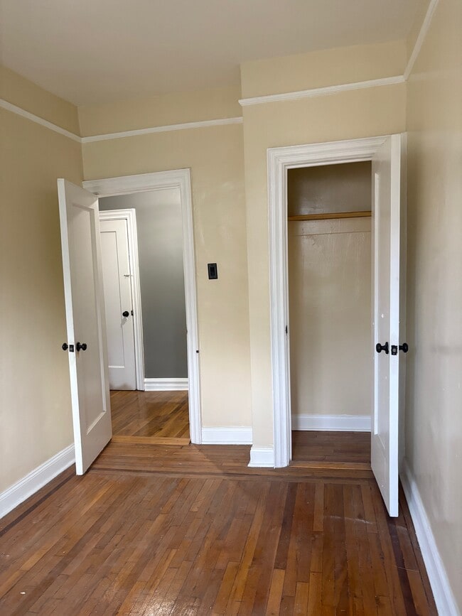 Otherside of room. Entry door, and closet door - 54 E Clifford Pl Unit 2