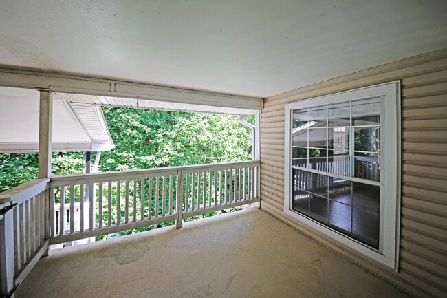 Photo - Updated top floor 2br with vaulted ceilings, two balconies and treed views! Unit 304
