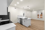 Open-Concept Kitchen with Recessed Lighting & Center Island Sink