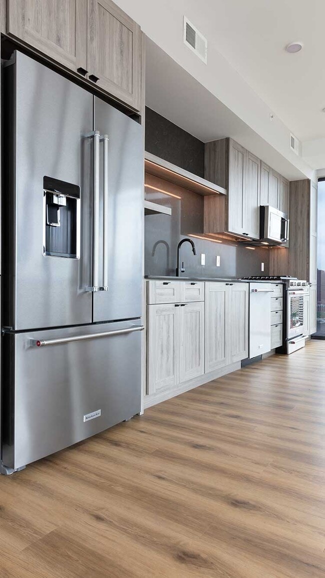 Penthouse-level Signature Collection apartment homes feature kitchens with upgraded appliances
