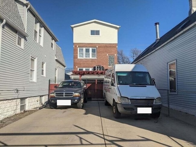 Building Photo - 2131 N Lorel Ave Unit 1