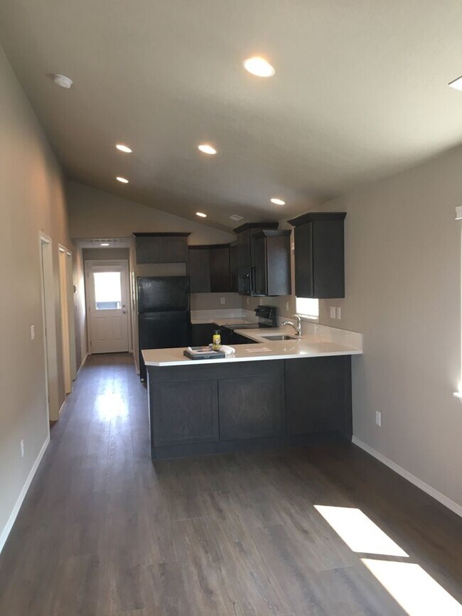 Photo - Cozy 2BR Home with Covered Patio & Animal-Friendly Yard – Utilities Included!