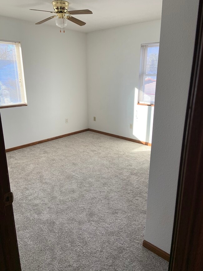 bedroom, brand new Bedroom 1, brand new carpeting and freshly painted walls. Bedroom has a closet - 20427 W Clark Ave Unit 7