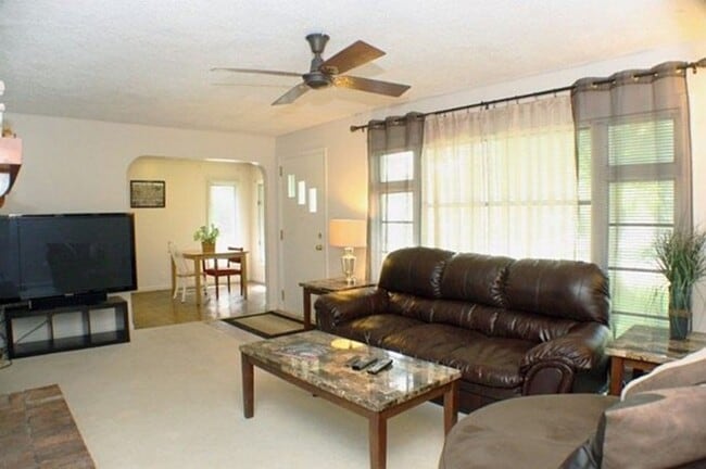 Photo - Corner Lot Charm: Spacious 3-Bed Home with Fireplace and Prime Location