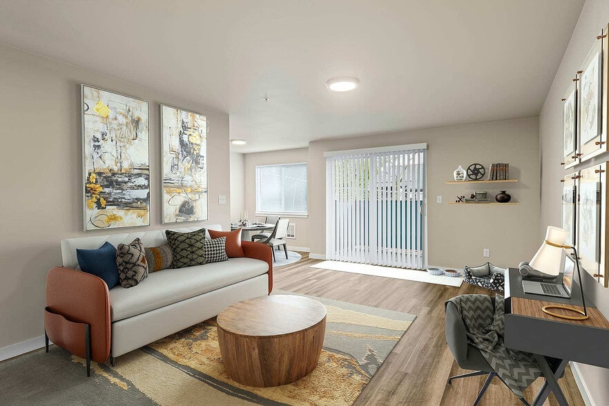 Spacious living room and dining nook in Foster Creek apartments, Tukwila, WA.