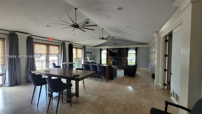Building Photo - 8871 Wiles Rd Unit 301