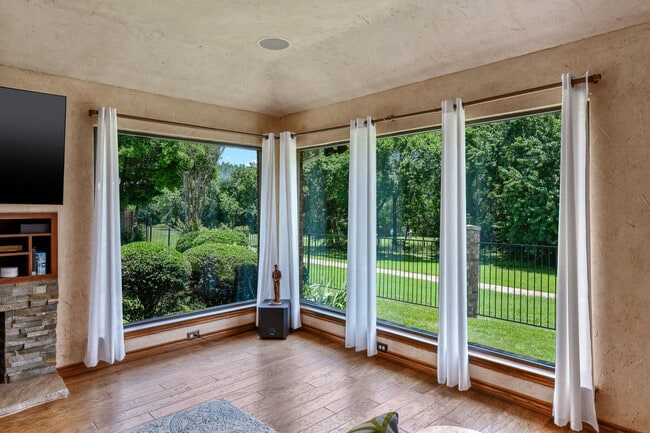 Relaxing view of golf course and greenbelt from living room window - 7300 Augusta Cir