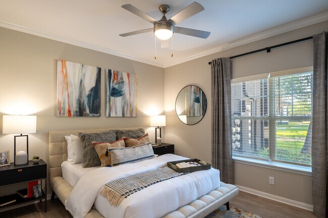Renovated Primary Bedroom - The Pointe at Vista Ridge Apartments