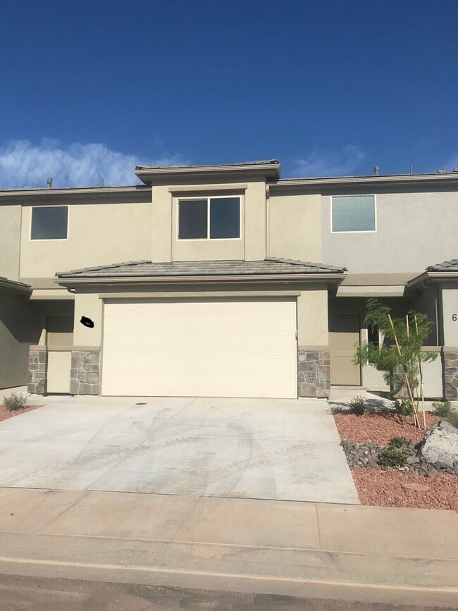 Building Photo - Amazing views! Like New 3 bedroom, 2.5 bath townhome, 2 car garage