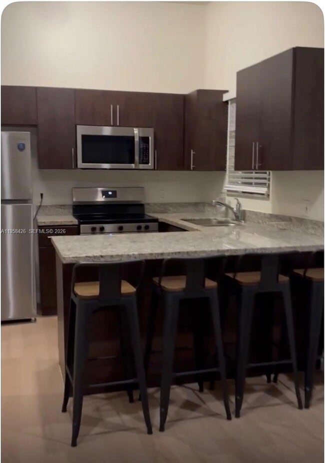 Building Photo - 3356 Bird Ave Unit 5