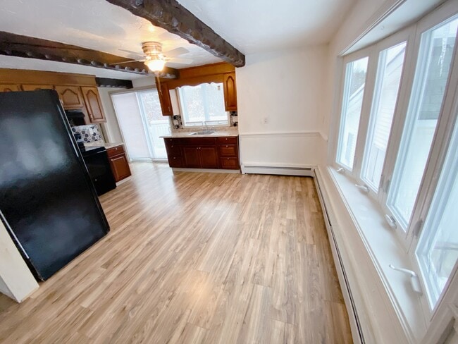 Kitchen with Bay Window and Deck Sliding Door - 423 Main St Unit Apartment