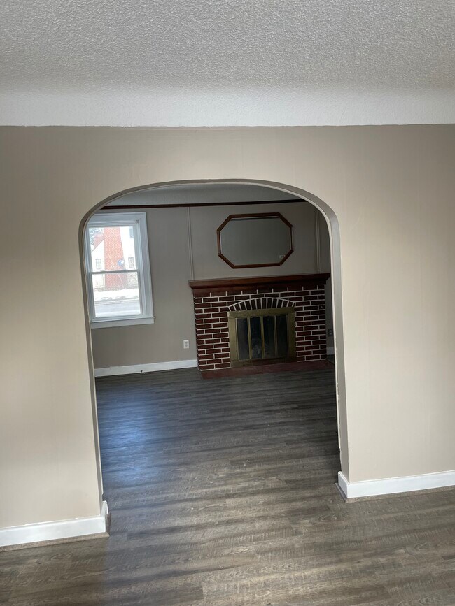 Enjoy the new laminate floors throughout the main level - 592 E Montcalm St