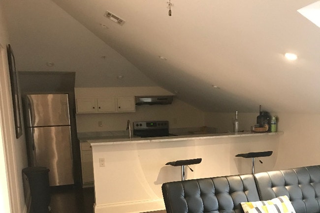kitchen & partial view of living room - 504 Dumaine St Apartments