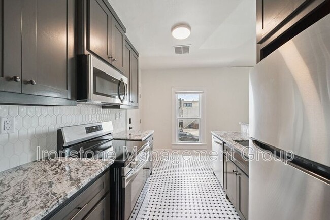 Building Photo - 1437 S Peoria Ave Rental