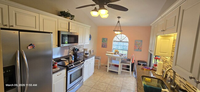 Photo - Welcome to **Caloosa Yacht & Racquet Club**, one of Fort Myers’ most desirable **gated waterfront...