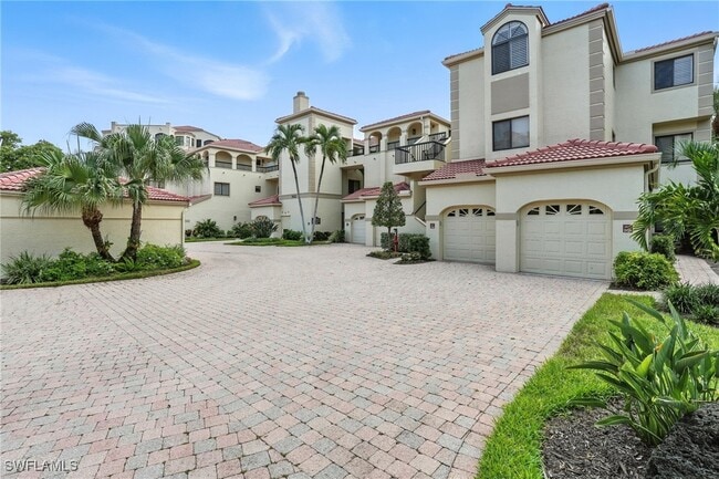 Building Photo - 7032 Pelican Bay Blvd Unit E304 Rental