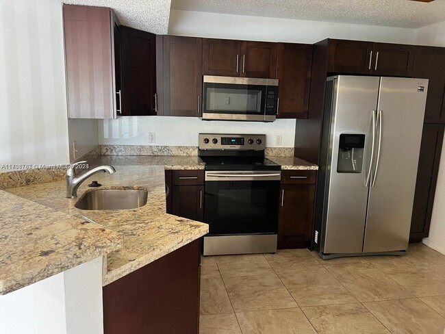 Photo - 8741 Wiles Rd Condo Unit 103