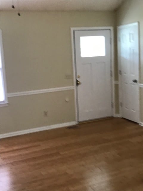Going out of living room to front porch - 698 Florida Dr