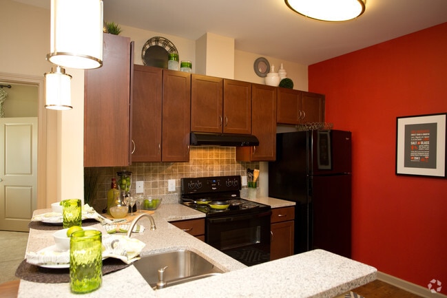 Kitchen with granite and black appliances 2BR, 2BA - 1,092 SF