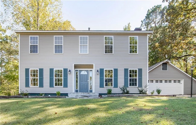 Building Photo - This Charming Two-Story Home Awaits You