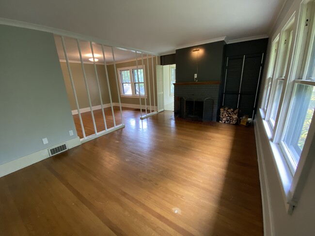 living room with fireplace - 445 N Winton Rd Apartments Unit Upper