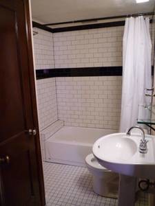 Bathroom with Subway tile. - 1605 St Paul St Unit 1