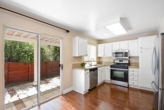 Photo - Modern 3BD 2.5BA Townhome with Vaulted Ceilings, Private Pergola Patio, and One-Car attached Garage