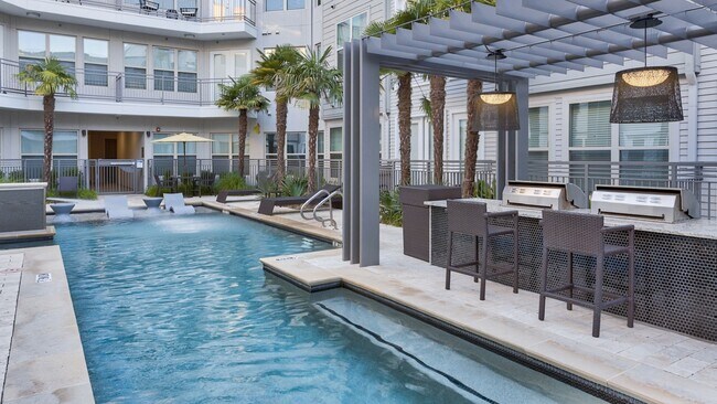 The poolside grilling station and dining island make for a great place to entertain friends and family