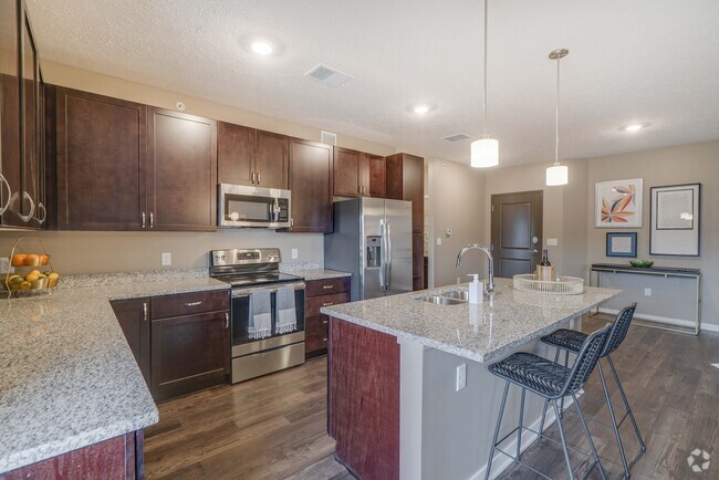 Our beautiful, modern kitchens have stainless steel appliances and plenty of counter space for all your cooking needs. - The Flats at Shadow Creek Rental